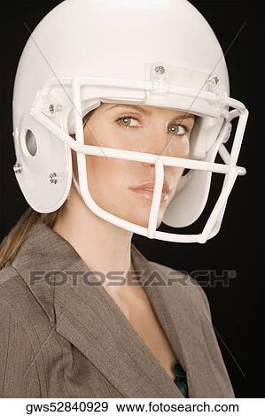 Portrait of a businesswoman wearing a sports helmet View Large Photo Image Stock Photo - Portrait of a businesswoman wearing a sports helmet. Fotosearch