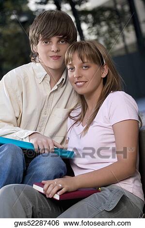 Portrait of a couple sitting together View Large Photo Image Stock Photograph - Portrait of a couple sitting together. Fotosearch