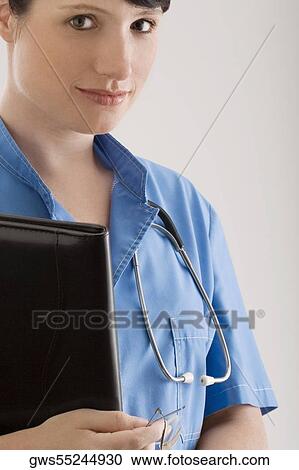 Stock Image - Portrait of a female doctor with a file. Fotosearch