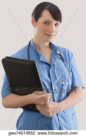 Portrait of a female doctor with a file View Large Photo Image Stock Image - Portrait of a female doctor with a file. Fotosearch