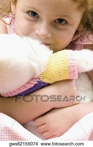 Portrait of a girl hugging a stuffed toy View Large Photo Image Picture - Portrait of a girl hugging a stuffed toy. Fotosearch