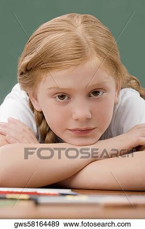 Portrait of a girl leaning on her elbows and thinking View Large Photo Image Stock Photo - Portrait of a girl leaning on her elbows and thinking. Fotosearch