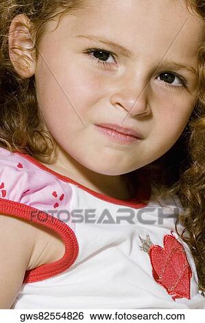 Portrait of a girl smirking View Large Photo Image Stock Photograph - Portrait of a girl smirking. Fotosearch