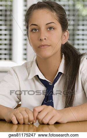 Portrait of a high school student sitting in a classroom View Large Photo Image Stock Photo - Portrait of a high school student sitting in a classroom. Fotosearch