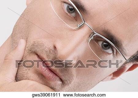 Portrait of a male doctor looking serious View Large Photo Image Stock Image - Portrait of a male doctor looking serious. Fotosearch