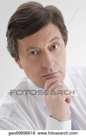 Portrait of a male doctor looking worried View Large Photo Image Stock Photo - Portrait of a male doctor looking worried. Fotosearch