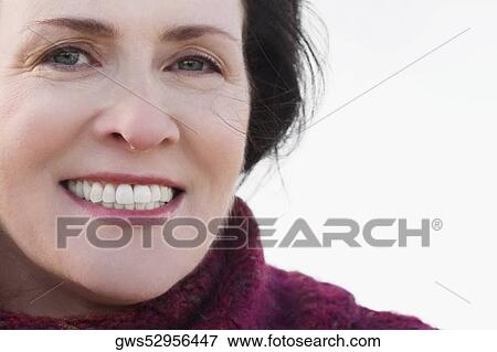 Stock Photo - Portrait of a mature woman smiling. Fotosearch