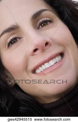 Stock Photography - Portrait of a mature woman smiling. Fotosearch