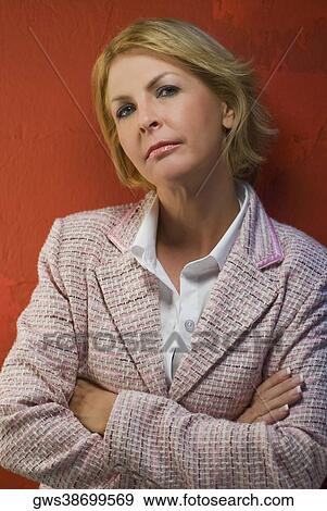Portrait of a mature woman standing View Large Photo Image Stock Photo - Portrait of a mature woman standing. Fotosearch