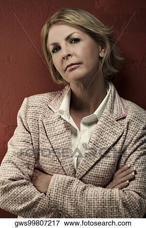 Portrait of a mature woman standing View Large Photo Image Stock Photo - Portrait of a mature woman standing. Fotosearch