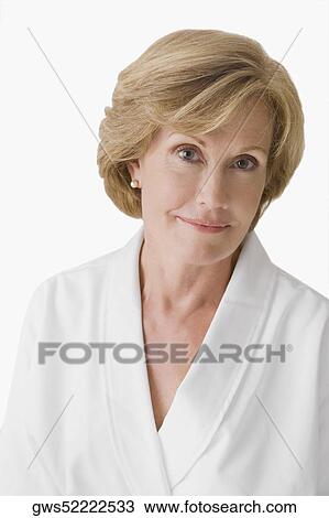 Portrait of a mature woman wearing a bathrobe and smiling View Large Photo Image Stock Image - Portrait of a mature woman wearing a bathrobe and smiling. Fotosearch
