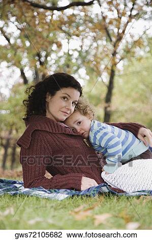Portrait of a mid adult woman with her daughter View Large Photo Image Stock Image - Portrait of a mid adult woman with her daughter. Fotosearch