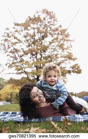 Portrait of a mid adult woman with her daughter smiling View Large Photo Image Stock Photography - Portrait of a mid adult woman with her daughter smiling. Fotosearch