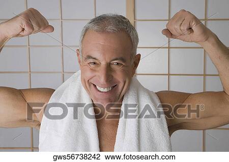 Portrait of a senior man flexing his muscles View Large Photo Image Stock Image - Portrait of a senior man flexing his muscles. Fotosearch