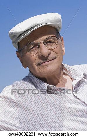 Portrait of a senior man smiling View Large Photo Image Stock Image - Portrait of a senior man smiling. Fotosearch