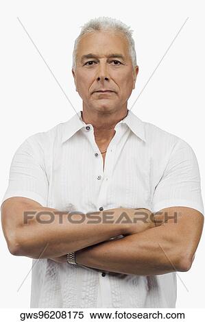 Portrait of a senior man standing with his arms crossed View Large Photo Image Stock Photography - Portrait of a senior man standing with his arms crossed. Fotosearch