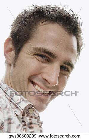Stock Photo - Portrait of a young man smiling. Fotosearch