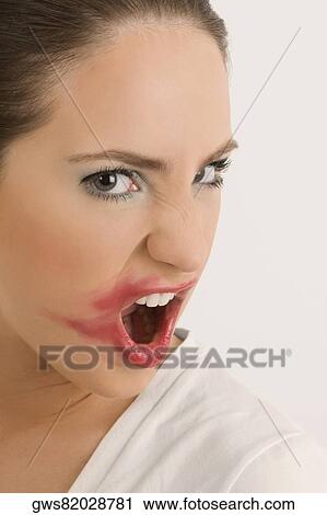 Portrait of a young woman with her messy lips View Large Photo Image Stock Image - Portrait of a young woman with her messy lips. Fotosearch
