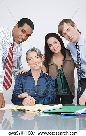 Portrait of business executives in a conference room View Large Photo Image Stock Photo - Portrait of business executives in a conference room. Fotosearch