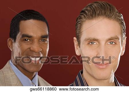 Stock Image - Portrait of two businessmen smiling. Fotosearch