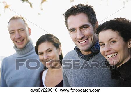 Stock Photo - Portrait of two couples smiling. Fotosearch