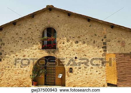 Potted plant on the window sill of a building, Piazza Roma, Monteriggioni, Siena Province, Tuscany, Italy View Large Photo Image Stock Image - Potted plant on the window sill of a building, Piazza Roma, Monteriggioni, Siena Province, Tuscany, Italy. Fotosearch
