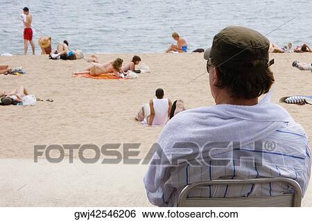 Rear view of a man on the beach, Plage de la Croisette, Cote d'Azur, Cannes, Provence-Alpes-Cote D'Azur, France View Large Photo Image Stock Photograph - Rear view of a man on the beach, Plage de la Croisette, Cote d'Azur, Cannes, Provence-Alpes-Cote D'Azur, France. Fotosearch
