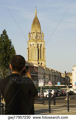 Rear view of a man photographing a church, Leglise Sainte-Marie De La Bastide, Bordeaux, Aquitaine, France View Large Photo Image Stock Image - Rear view of a man photographing a church, Leglise Sainte-Marie De La Bastide, Bordeaux, Aquitaine, France. Fotosearch