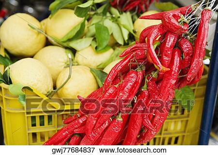 Red chili peppers with guavas at a market stall, Sorrento, Sorrentine Peninsula, Naples Province, Campania, Italy View Large Photo Image Stock Photo - Red chili peppers with guavas at a market stall, Sorrento, Sorrentine Peninsula, Naples Province, Campania, Italy. Fotosearch