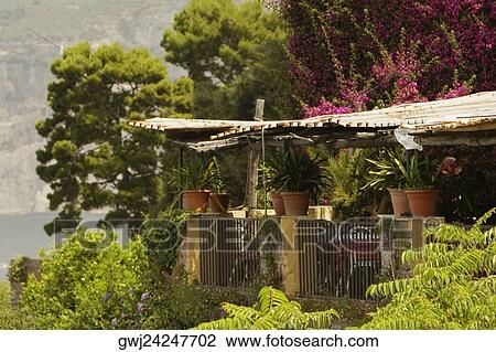 Stock Image - Restaurant surrounded with trees, Sorrento, Naples Province, Campania, Italy. Fotosearch