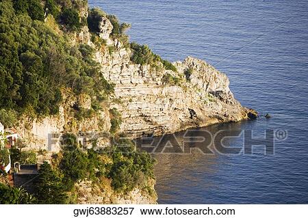 Rock formation at the seaside, Costiera Amalfitana, Salerno, Campania, Italy View Large Photo Image Stock Photo - Rock formation at the seaside, Costiera Amalfitana, Salerno, Campania, Italy. Fotosearch