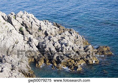 Rock formation at the seaside, Costiera Amalfitana, Salerno, Campania, Italy View Large Photo Image Stock Photography - Rock formation at the seaside, Costiera Amalfitana, Salerno, Campania, Italy. Fotosearch