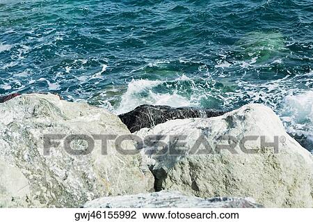 Rock formations in the sea, Italian Riviera, Mar Ligure, Genoa, Liguria, Italy View Large Photo Image Stock Image - Rock formations in the sea, Italian Riviera, Mar Ligure, Genoa, Liguria, Italy. Fotosearch