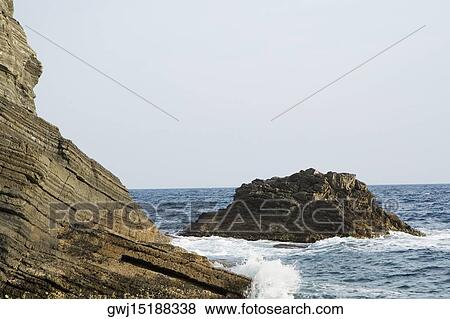 Rock formations in the sea, Italian Riviera, Mar Ligure, Genoa, Liguria, Italy View Large Photo Image Stock Photo - Rock formations in the sea, Italian Riviera, Mar Ligure, Genoa, Liguria, Italy. Fotosearch