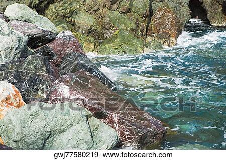 Rock formations in the sea, Italian Riviera, Mar Ligure, Genoa, Liguria, Italy View Large Photo Image Stock Photo - Rock formations in the sea, Italian Riviera, Mar Ligure, Genoa, Liguria, Italy. Fotosearch