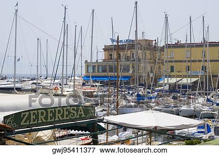 Sailboats at a harbor, Santa Lucia, Borgo Marinaro, Bay of Naples, Naples, Naples Province, Campania, Italy View Large Photo Image Stock Photo - Sailboats at a harbor, Santa Lucia, Borgo Marinaro, Bay of Naples, Naples, Naples Province, Campania, Italy. Fotosearch