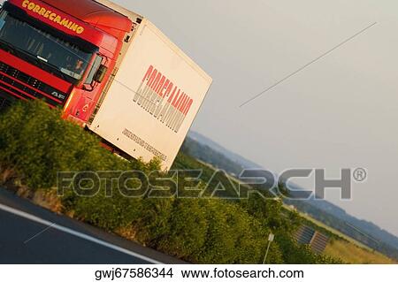 Picture - Semi-truck moving on the road, Loire Valley, France. Fotosearch