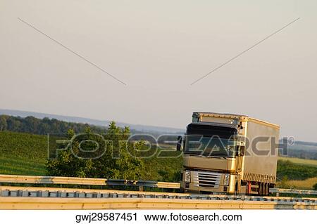 Semi-truck moving on the road, Loire Valley, France View Large Photo Image Stock Image - Semi-truck moving on the road, Loire Valley, France. Fotosearch