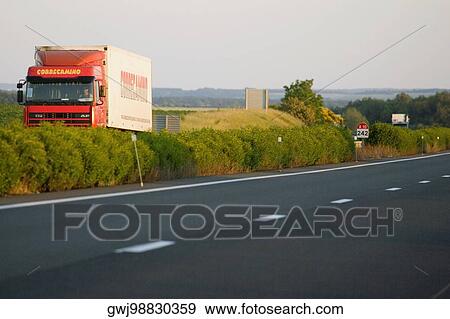 Semi-truck moving on the road, Loire Valley, France View Large Photo Image Stock Photo - Semi-truck moving on the road, Loire Valley, France. Fotosearch