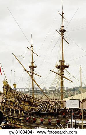 Stock Photo - Ship docked at a harbor, Porto Antico, Genoa, Italy. Fotosearch