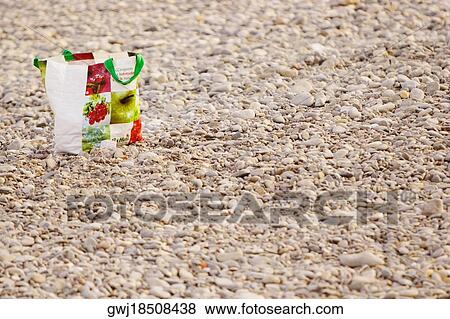 Shopping bag on the beach, Nice, Provence-Alpes-Cote D'Azur, France View Large Photo Image Stock Photo - Shopping bag on the beach, Nice, Provence-Alpes-Cote D'Azur, France. Fotosearch