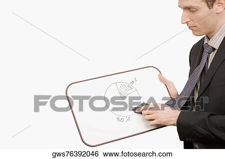 Side profile of a businessman rubbing a pie chart with his tie View Large Photo Image Stock Photograph - Side profile of a businessman rubbing a pie chart with his tie. Fotosearch