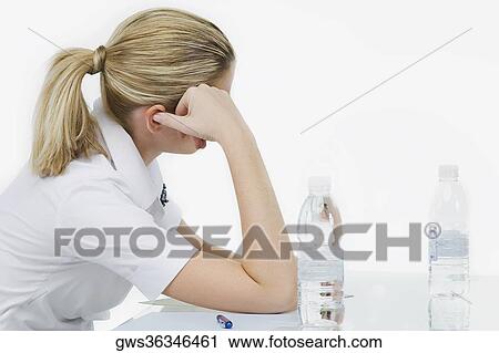 Side profile of a businesswoman sitting in the office View Large Photo Image Stock Image - Side profile of a businesswoman sitting in the office. Fotosearch