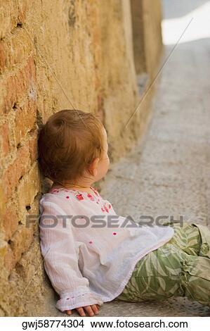 Side profile of a girl leaning against a wall, Monteriggioni, Siena Province, Tuscany, Italy View Large Photo Image Picture - Side profile of a girl leaning against a wall, Monteriggioni, Siena Province, Tuscany, Italy. Fotosearch