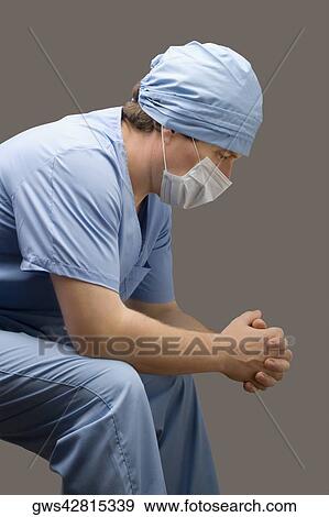 Side profile of a male surgeon thinking View Large Photo Image Stock Photo - Side profile of a male surgeon thinking. Fotosearch