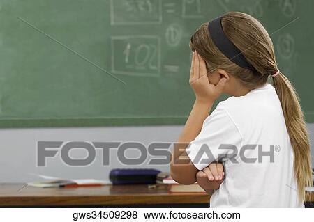 Side profile of a schoolgirl looking sad View Large Photo Image Stock Photo - Side profile of a schoolgirl looking sad. Fotosearch
