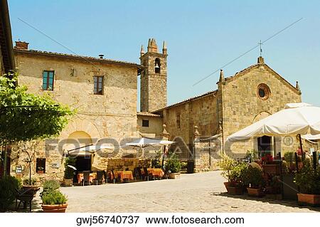 Sidewalk cafe in front of a church, Romanesque Church, Piazza Roma, Monteriggioni, Siena Province, Tuscany, Italy View Large Photo Image Stock Photo - Sidewalk cafe in front of a church, Romanesque Church, Piazza Roma, Monteriggioni, Siena Province, Tuscany, Italy. Fotosearch