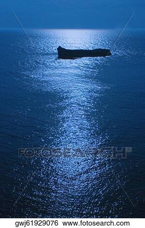 Silhouette of a boat in the sea at night, Biarritz, Basque Country, Pyrenees-Atlantiques, Aquitaine, France View Large Photo Image Stock Photograph - Silhouette of a boat in the sea at night, Biarritz, Basque Country, Pyrenees-Atlantiques, Aquitaine, France. Fotosearch