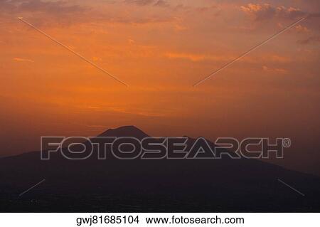 Silhouette of a mountain at sunset, Mt Vesuvius, Naples, Campania, Italy View Large Photo Image Picture - Silhouette of a mountain at sunset, Mt Vesuvius, Naples, Campania, Italy. Fotosearch
