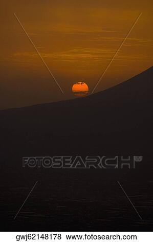 Stock Photo - Silhouette of a mountain at sunset, Mt Vesuvius, Naples, Campania, Italy. Fotosearch